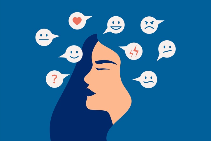 Photo of woman's face with multiple emojis around her head to depict emotions