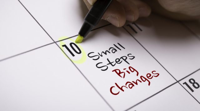 Photo of a calendar with "small steps big changes" written in one date box