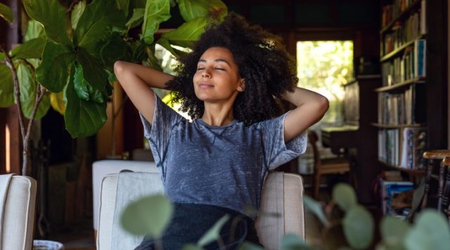 Photo of a women relaxing in a chair looking content