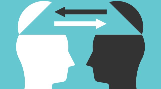 Two open heads silhouettes with arrows exchanging thoughts. Communication, idea, knowledge, teamwork and education concept.