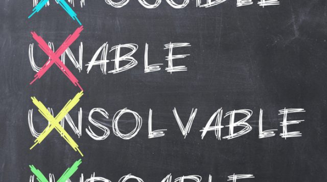 4 words written on a chalkboard, all with the first 2 letters crossed out with an "x": "Impossible", "Unable", "Unsolvable", and "undoable"