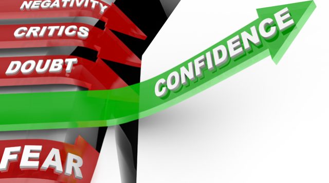 4 red arrows going downward (one says "negativity", one says "critics", one says "doubt", and one says "fear") and one green arrow going upward that says "confidence"