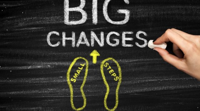 "Small steps, big changes" written on a chalkboard