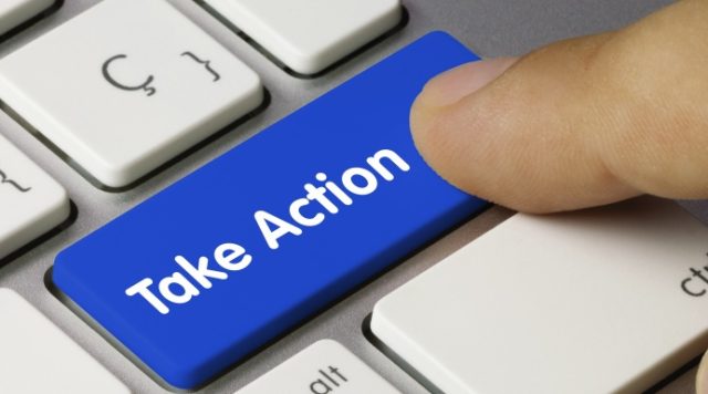Photo of a computer keyboard with a person's finger hovering over a blue button that says "take action"